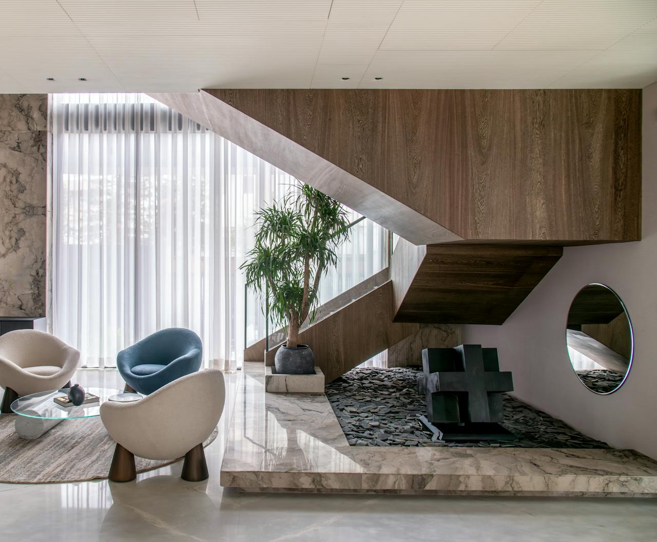 Chic interior showcasing a modern staircase, elegant seating, and decorative elements.